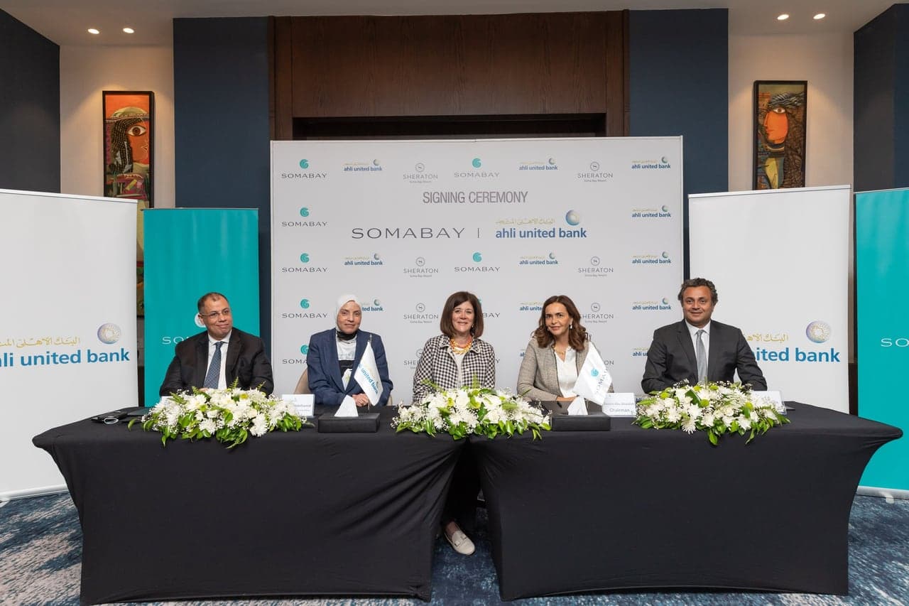 Ahli United Bank and Somabay representatives at the signing table.