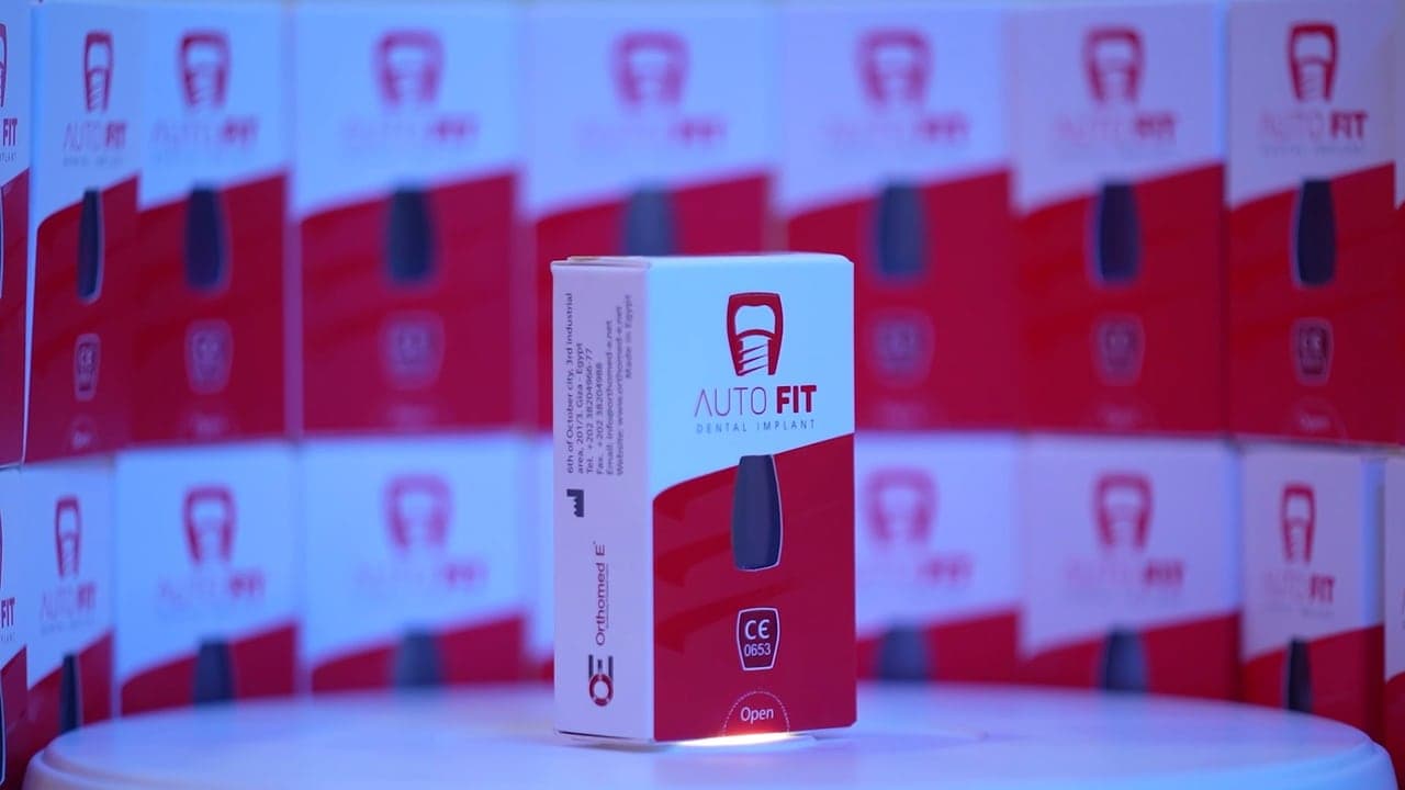 An Autofit implant box in front of a wall of boxes.