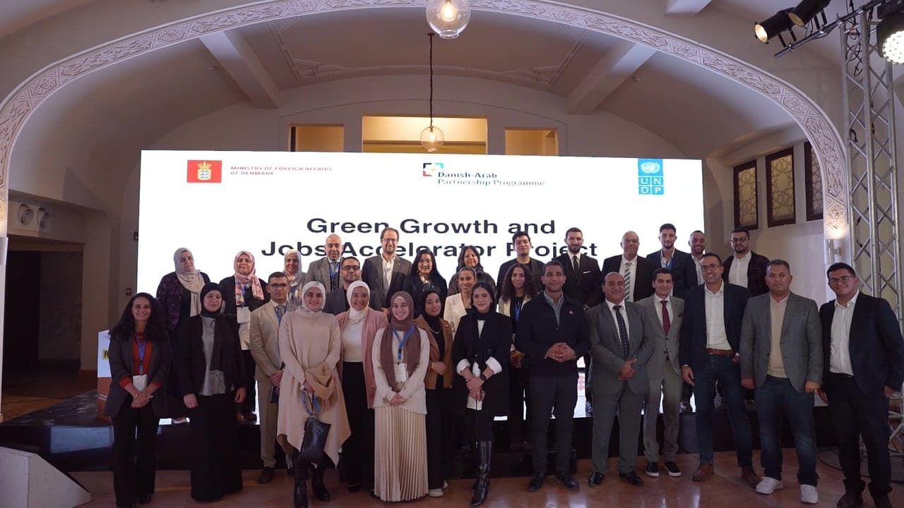 The cohort and partners in a group photo under the GGJAP banner.