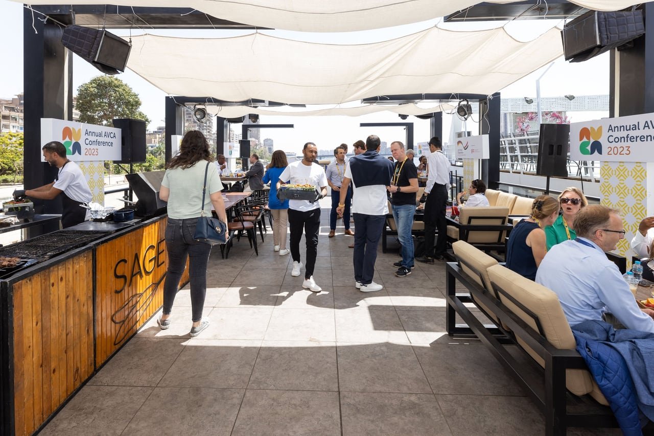 Guests moving through the boat’s shaded lounge.