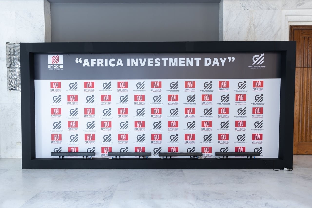 The photo backdrop with the organisers’ logos, ready before guests arrived.