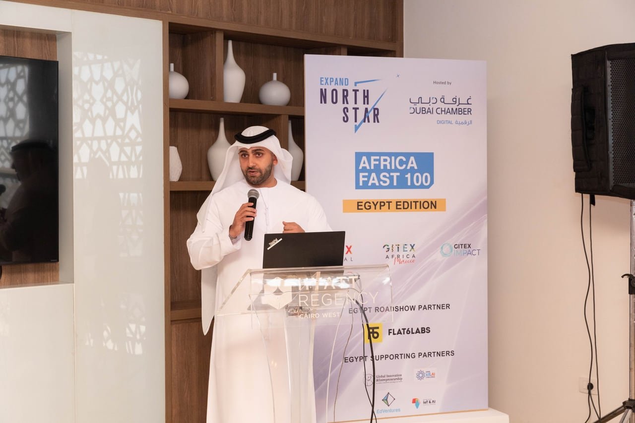 The podium and the Dubai Chamber banner carrying the programme and its partners.
