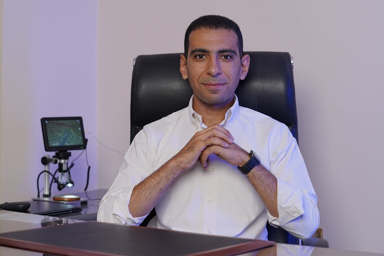 An Autofit team member seated for his interview on set.
