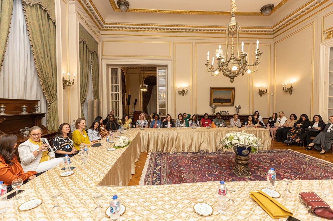 The session around the table under the chandeliers.