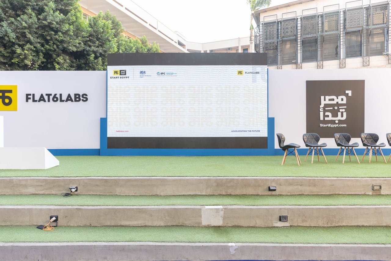 The stage, the StartEgypt screen and the green turf in the courtyard before guests arrived.