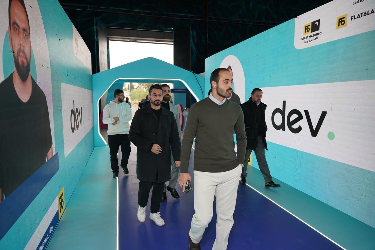 Guests walking through the branded entrance tunnel.