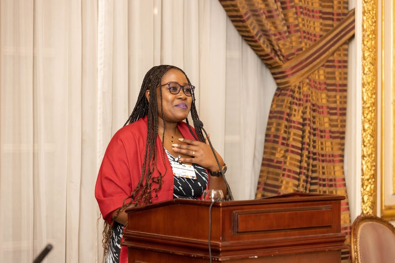 A speaker at the wooden podium.