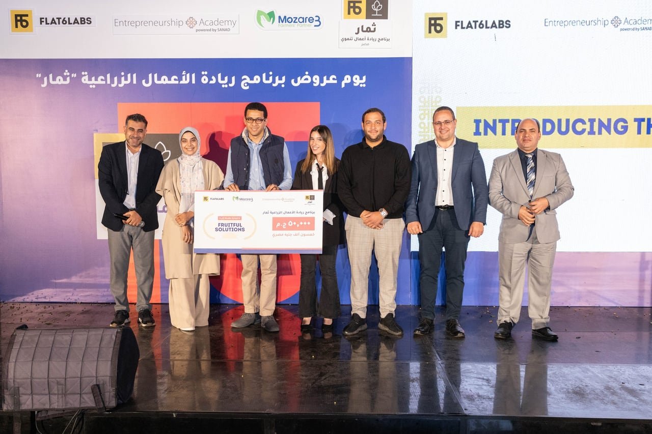 The winners and partners on stage with the prize cheque.