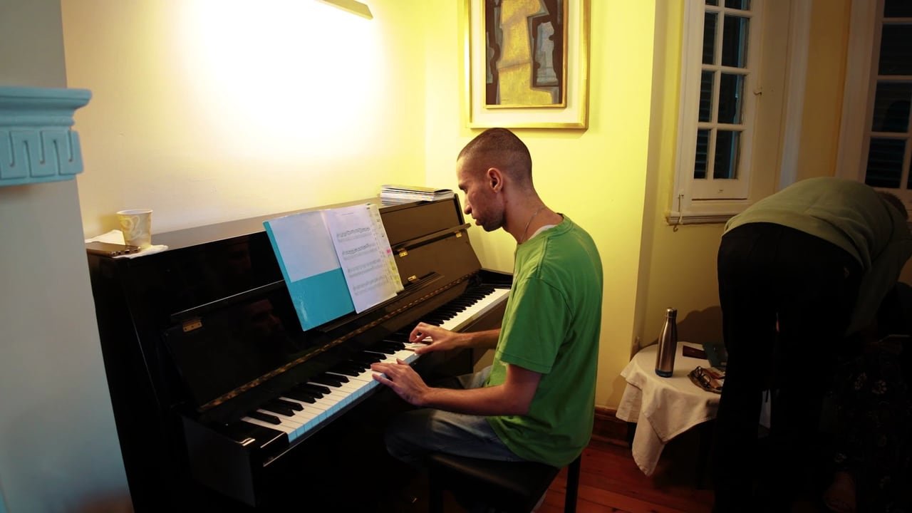 A pianist playing in one of the club’s rooms.
