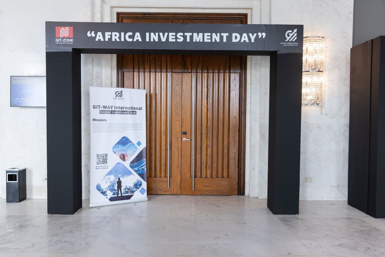 The Africa Investment Day gate at the entrance, with a GIT-Zone International roll-up beside it.