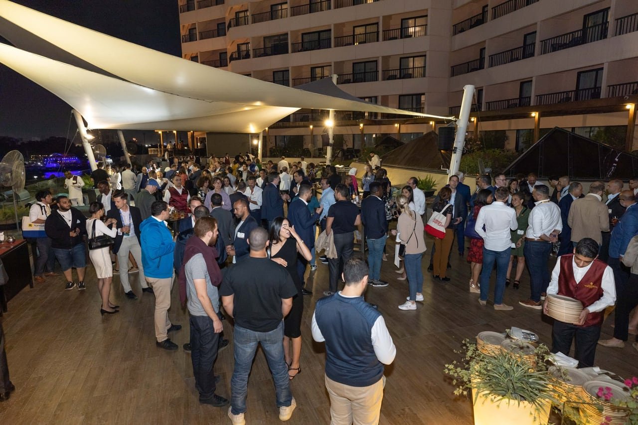 The Sawari Ventures rooftop full of guests under the white sails.