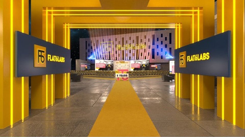 3D render of the yellow entrance tunnel leading into the hall.