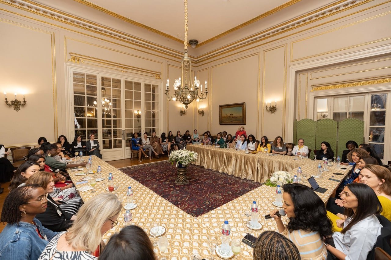 Guests around the U-shaped table in the main hall.