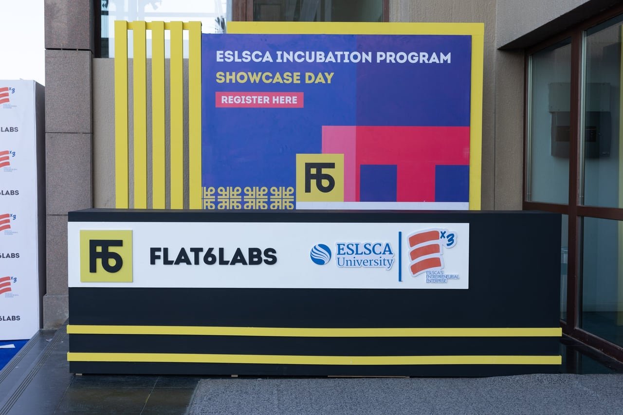 The registration desk carrying the Flat6Labs and ESLSCA University logos.
