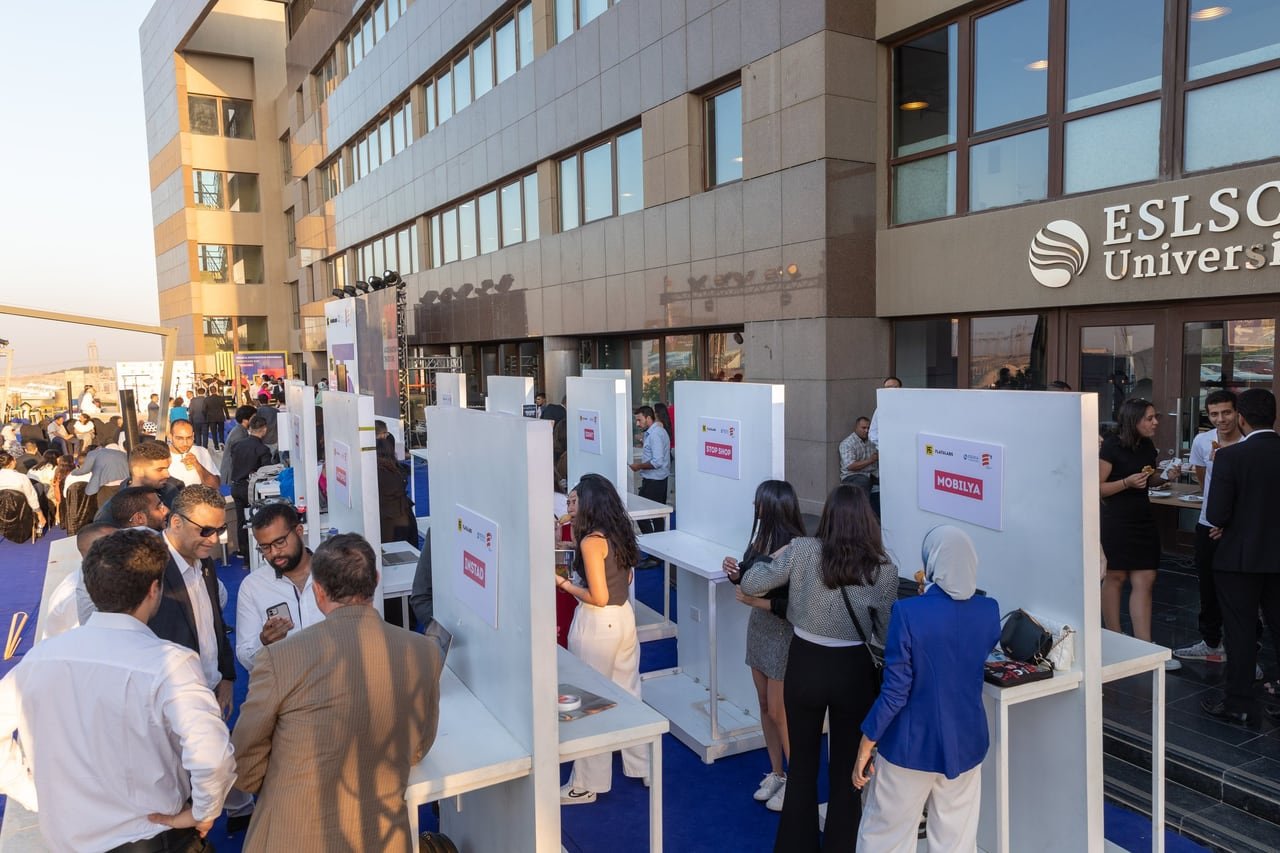 The stands and guests outside the ESLSCA University building.