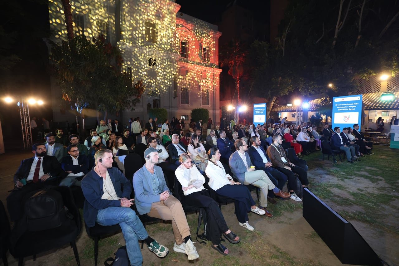 Guests seated in a garden facing the lit stage at the GGJAP closing ceremony.