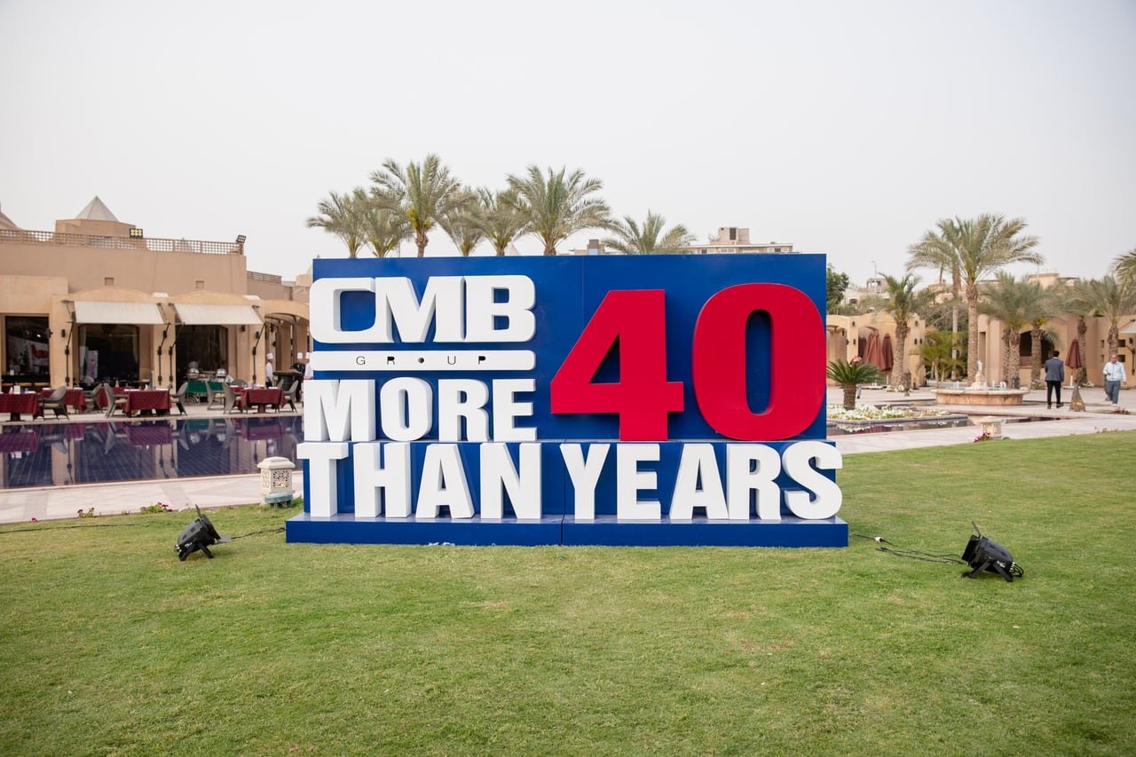 The “CMB More Than 40 Years” sign in the garden.