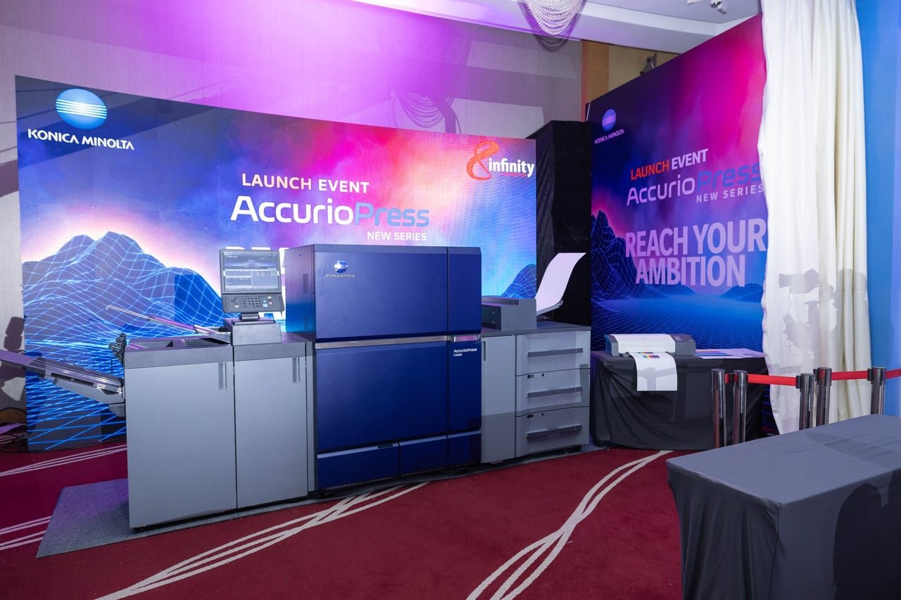 The live press zone with AccurioPress machines behind a rope.