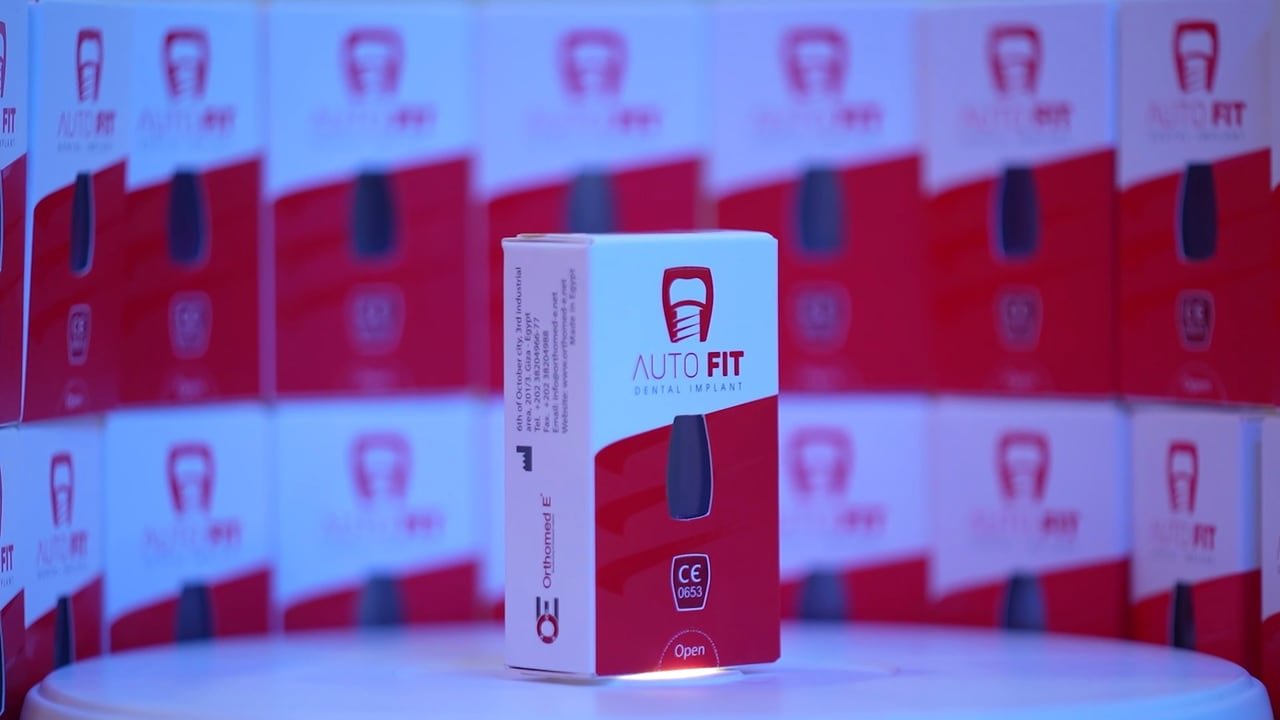 An Autofit implant box in front of a wall of boxes.