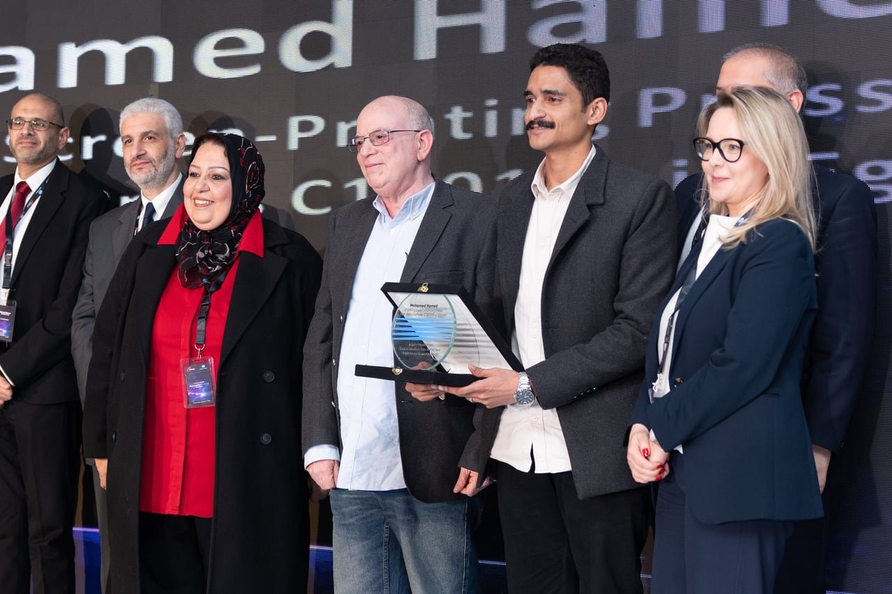 An honour presented on stage.