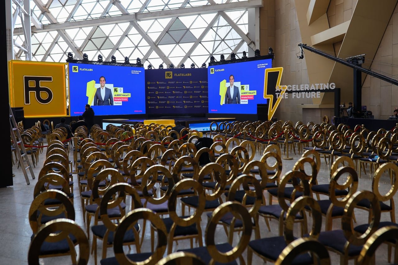 The hall set with gold chairs and screens before guests arrived.