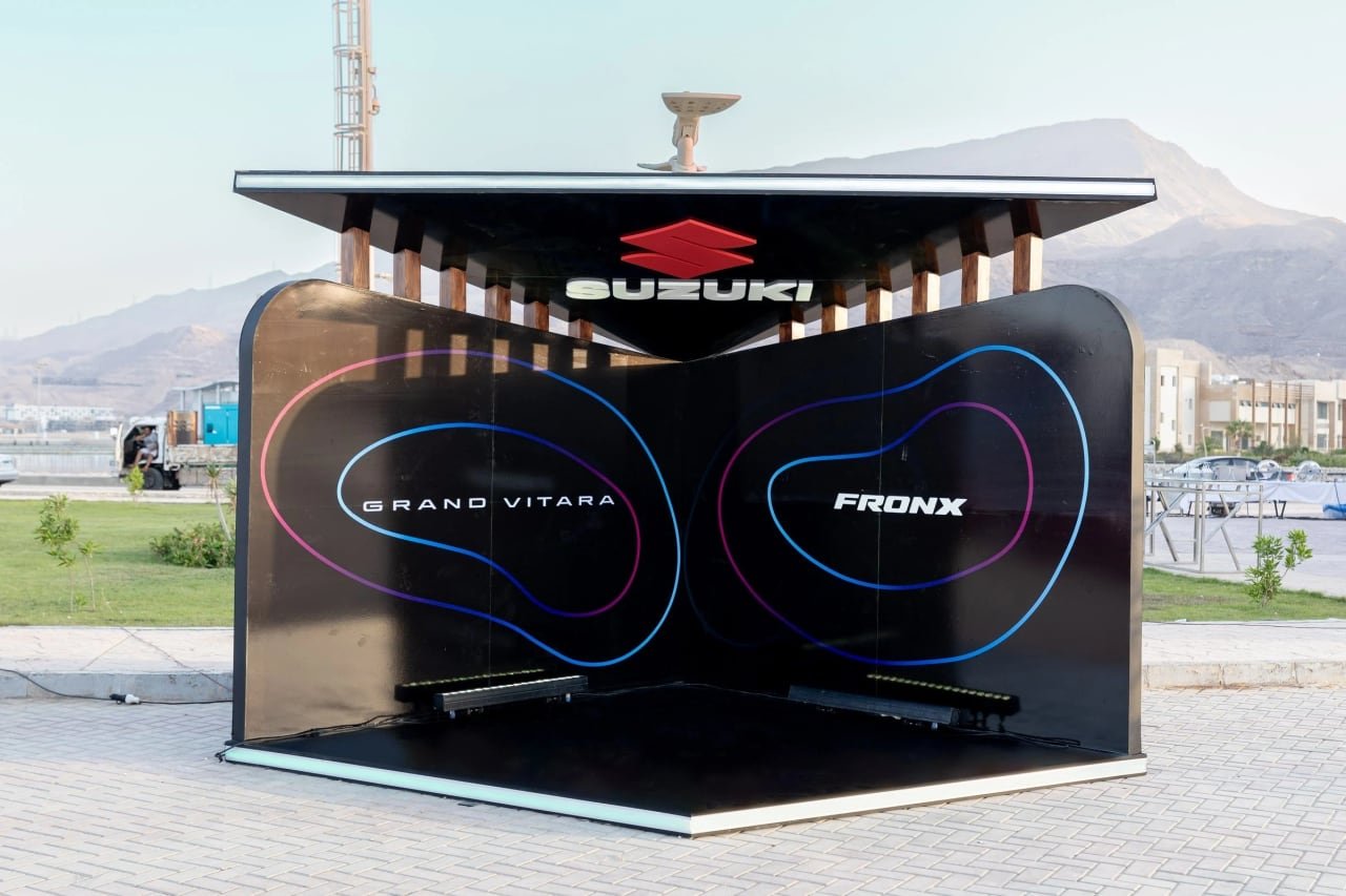 The Suzuki product booth with Grand Vitara and Fronx graphics.